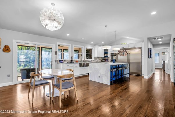 Dining room, Interior, Kitchen, Pendant Lights, Recessed Lighting, Stainless Steel Appliances, Wood Texture Flooring