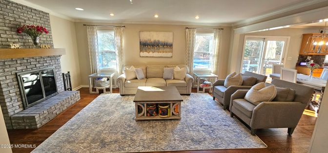Fireplace, Interior, Living room, Pendant Lights, Recessed Lighting, Stone Walls, Wood Texture Flooring
