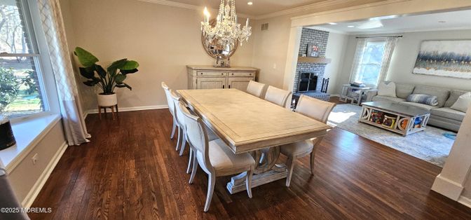 Chandelier, Dining room, Fireplace, Interior, Living room, Recessed Lighting, Wood Texture Flooring