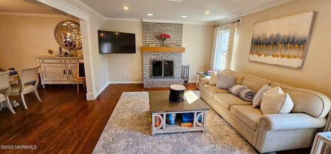 Fireplace, Interior, Living room, Recessed Lighting, Stone Walls, Wood Texture Flooring