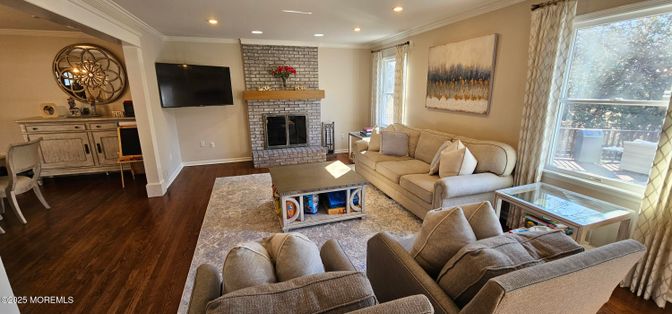 Fireplace, Interior, Living room, Recessed Lighting, Stone Walls, Wood Texture Flooring