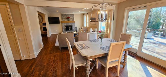 Dining room, Fireplace, Interior, Living room, Pendant Lights, Recessed Lighting, Stone Walls, Wood Texture Flooring
