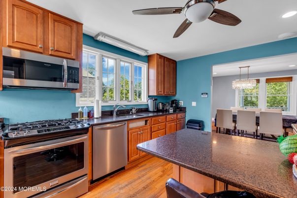 Chandelier, Dining room, Interior, Kitchen, Recessed Lighting, Stainless Steel Appliances, Wood Texture Flooring