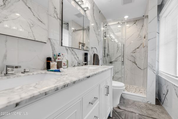 Bathroom, Dual Sink Vanities, Glass Shower, Interior, Marble, Marble Walls