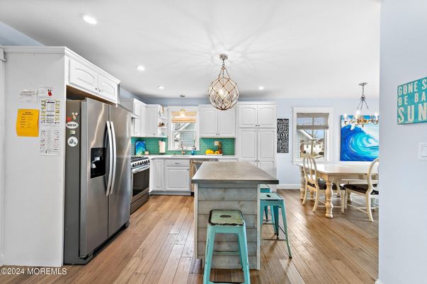 Dining room, Interior, Kitchen, Pendant Lights, Recessed Lighting, Stainless Steel Appliances, Wood Texture Flooring