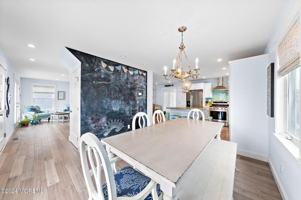 Chandelier, Dining room, Interior, Kitchen, Pendant Lights, Recessed Lighting, Stainless Steel Appliances, Wood Texture Flooring