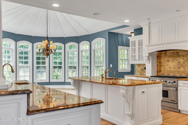 Chandelier, Interior, Kitchen, Pendant Lights, Recessed Lighting, Stainless Steel Appliances, Wood Texture Flooring