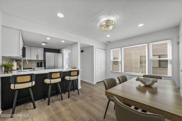 Dining room, Interior, Kitchen, Recessed Lighting, Stainless Steel Appliances, Wood Texture Flooring
