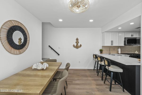 Dining room, Interior, Kitchen, Recessed Lighting, Stainless Steel Appliances, Wood Texture Flooring