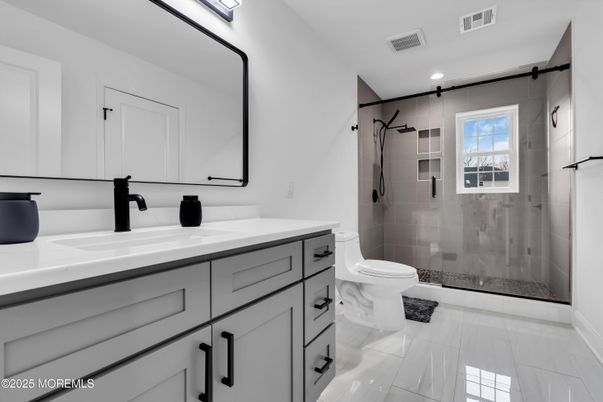 Bathroom, Dual Sink Vanities, Glass Shower, Interior, Marble, Recessed Lighting