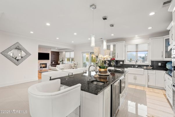 Fireplace, Interior, Kitchen, Living room, Pendant Lights, Recessed Lighting, Stainless Steel Appliances, Stone Walls