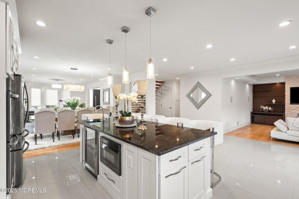 Chandelier, Dining room, Interior, Kitchen, Living room, Pendant Lights, Recessed Lighting, Wood Texture Flooring