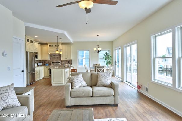 Chandelier, Dining room, Interior, Kitchen, Pendant Lights, Recessed Lighting, Stainless Steel Appliances, Wood Texture Flooring