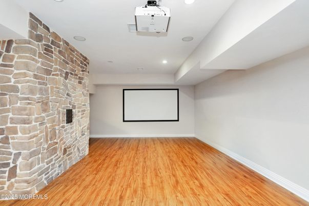 Empty room, Interior, Projection Screen, Recessed Lighting, Stone Walls, Wood Texture Flooring