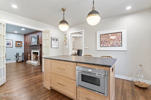 Dining room, Fireplace, Interior, Kitchen, Pendant Lights, Recessed Lighting, Wood Texture Flooring