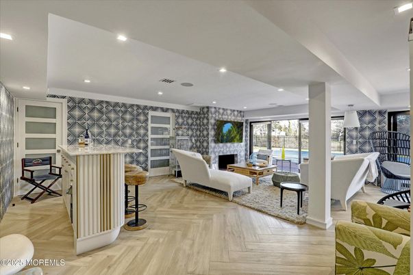 Fireplace, Interior, Living room, Recessed Lighting, Stone Walls, Wood Texture Flooring