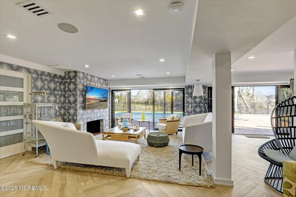 Fireplace, Interior, Living room, Recessed Lighting, Stone Walls, Wood Texture Flooring