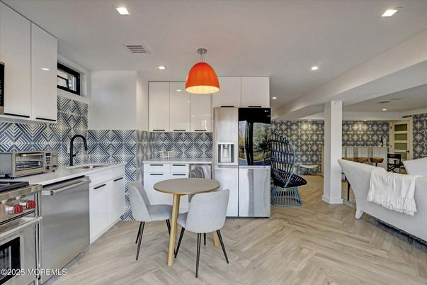 Dining room, Interior, Kitchen, Pendant Lights, Recessed Lighting, Stainless Steel Appliances, Wood Texture Flooring