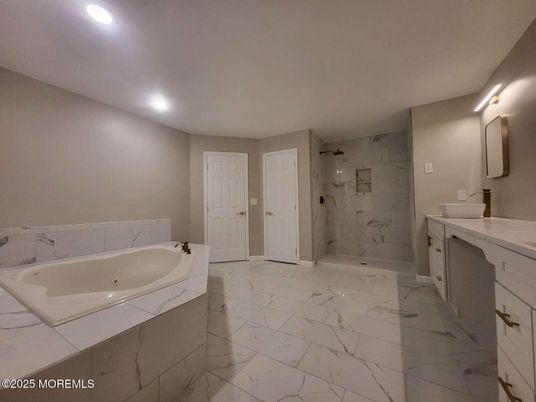 Bathroom, Dual Sink Vanities, Interior, Marble, Marble Walls, Recessed Lighting