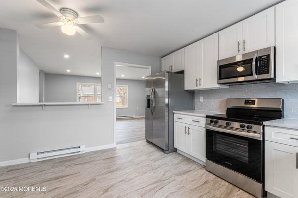 Interior, Kitchen, Recessed Lighting, Stainless Steel Appliances, Wood Texture Flooring