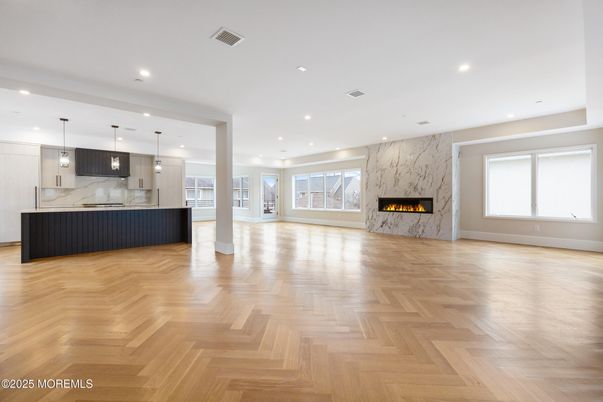 Fireplace, Interior, Kitchen, Marble Walls, Pendant Lights, Recessed Lighting, Wood Texture Flooring