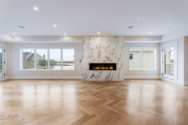 Empty room, Fireplace, Interior, Marble Walls, Recessed Lighting, Wood Texture Flooring