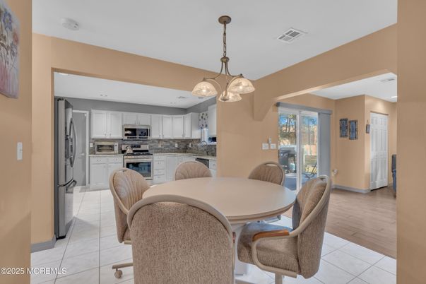 Dining room, Interior, Kitchen, Pendant Lights, Stainless Steel Appliances, Wood Texture Flooring