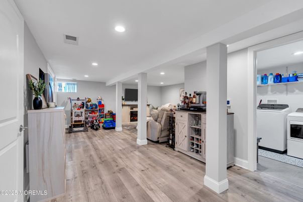 Fireplace, Interior, Recessed Lighting, Washer, Wood Texture Flooring
