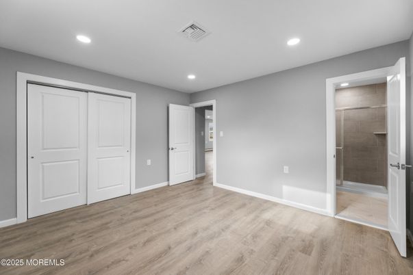 Bathroom, Empty room, Glass Shower, Interior, Recessed Lighting, Wood Texture Flooring