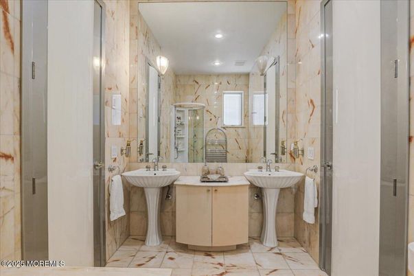 Bathroom, Dual Sink Vanities, Glass Shower, Interior, Marble Walls, Recessed Lighting