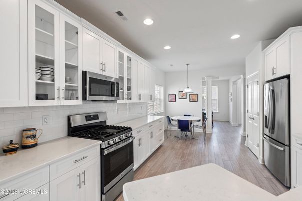 Dining room, Interior, Kitchen, Pendant Lights, Recessed Lighting, Stainless Steel Appliances, Wood Texture Flooring