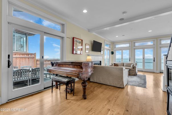 Fireplace, Interior, Living room, Piano, Recessed Lighting, Water, Wood Texture Flooring