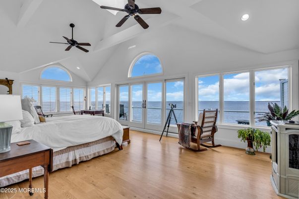 Bedroom, Fireplace, Interior, Recessed Lighting, Water, Wood Texture Flooring