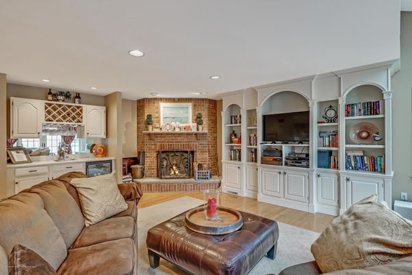 Fireplace, Interior, Living room, Recessed Lighting, Stone Walls, Wood Texture Flooring