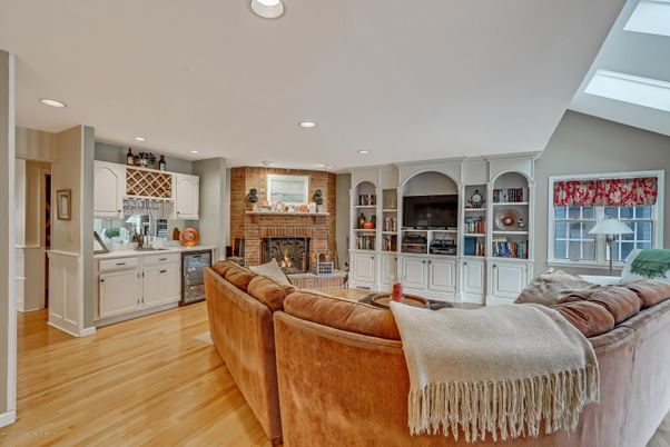 Fireplace, Interior, Kitchen, Living room, Recessed Lighting, Stone Walls, Wood Texture Flooring