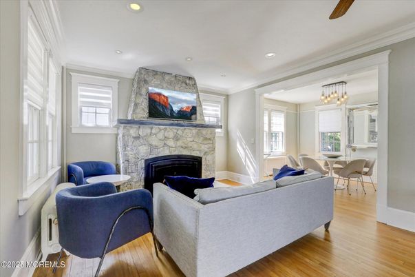 Chandelier, Dining room, Fireplace, Interior, Living room, Recessed Lighting, Wood Texture Flooring