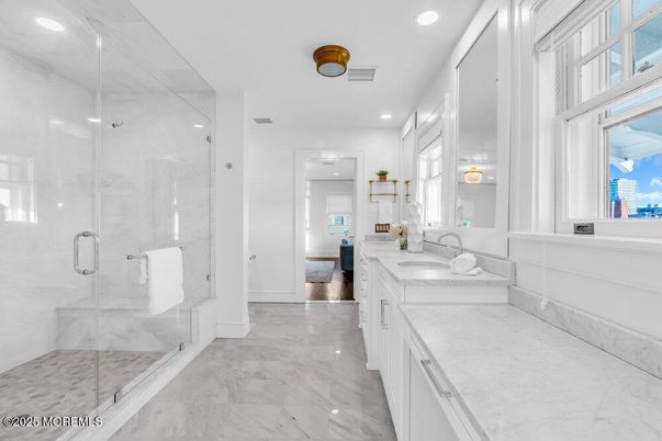Bathroom, Dual Sink Vanities, Glass Shower, Interior, Marble, Marble Walls, Recessed Lighting
