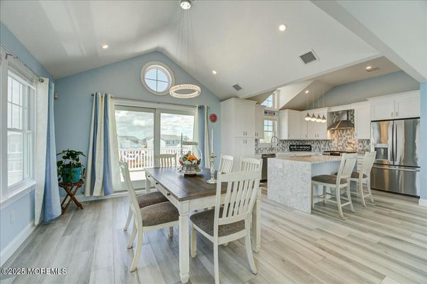 Dining room, Interior, Kitchen, Pendant Lights, Recessed Lighting, Stainless Steel Appliances, Wood Texture Flooring