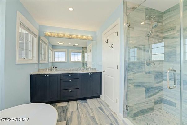 Bathroom, Dual Sink Vanities, Free Standing Baths, Glass Shower, Interior, Recessed Lighting, Wood Texture Flooring