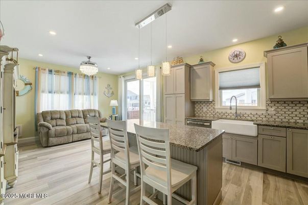 Chandelier, Dining room, Interior, Kitchen, Pendant Lights, Recessed Lighting, Stainless Steel Appliances, Wood Texture Flooring