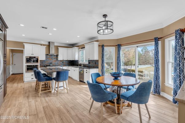 Dining room, Interior, Kitchen, Recessed Lighting, Stainless Steel Appliances, Wood Texture Flooring