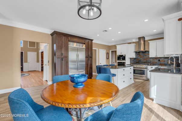Dining room, Interior, Kitchen, Recessed Lighting, Stainless Steel Appliances, Wood Texture Flooring