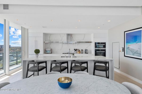 Interior, Kitchen, Marble Walls, Recessed Lighting, Stainless Steel Appliances, Wood Texture Flooring