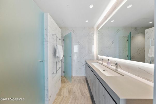 Bathroom, Dual Sink Vanities, Glass Shower, Interior, Marble Walls, Recessed Lighting