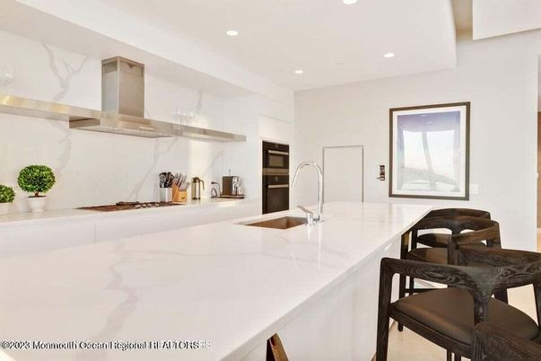 Interior, Kitchen, Marble Walls, Recessed Lighting, Stainless Steel Appliances