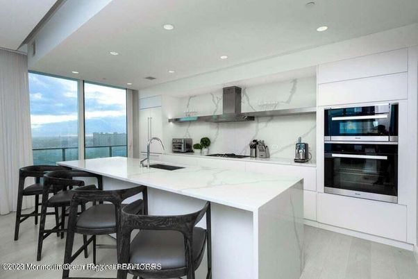 Interior, Kitchen, Marble Walls, Recessed Lighting, Stainless Steel Appliances, Wood Texture Flooring