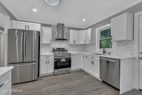 Interior, Kitchen, Marble Walls, Recessed Lighting, Stainless Steel Appliances, Wood Texture Flooring