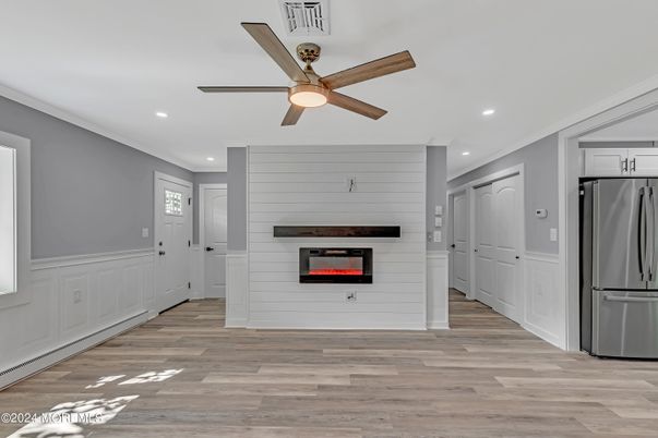 Fireplace, Interior, Kitchen, Recessed Lighting, Stainless Steel Appliances, Wood Texture Flooring