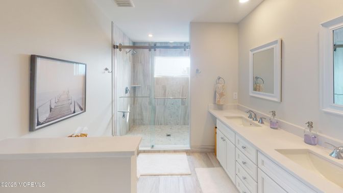 Bathroom, Dual Sink Vanities, Glass Shower, Interior, Recessed Lighting, Wood Texture Flooring