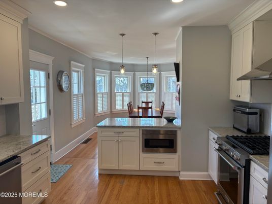 Dining room, Interior, Kitchen, Pendant Lights, Recessed Lighting, Stainless Steel Appliances, Wood Texture Flooring